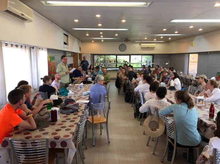 Orientation meeting in the kibbutz dining room